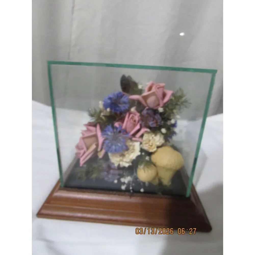 Vintage dried flower arrangement in glass with wood base butterfly mushrooms
